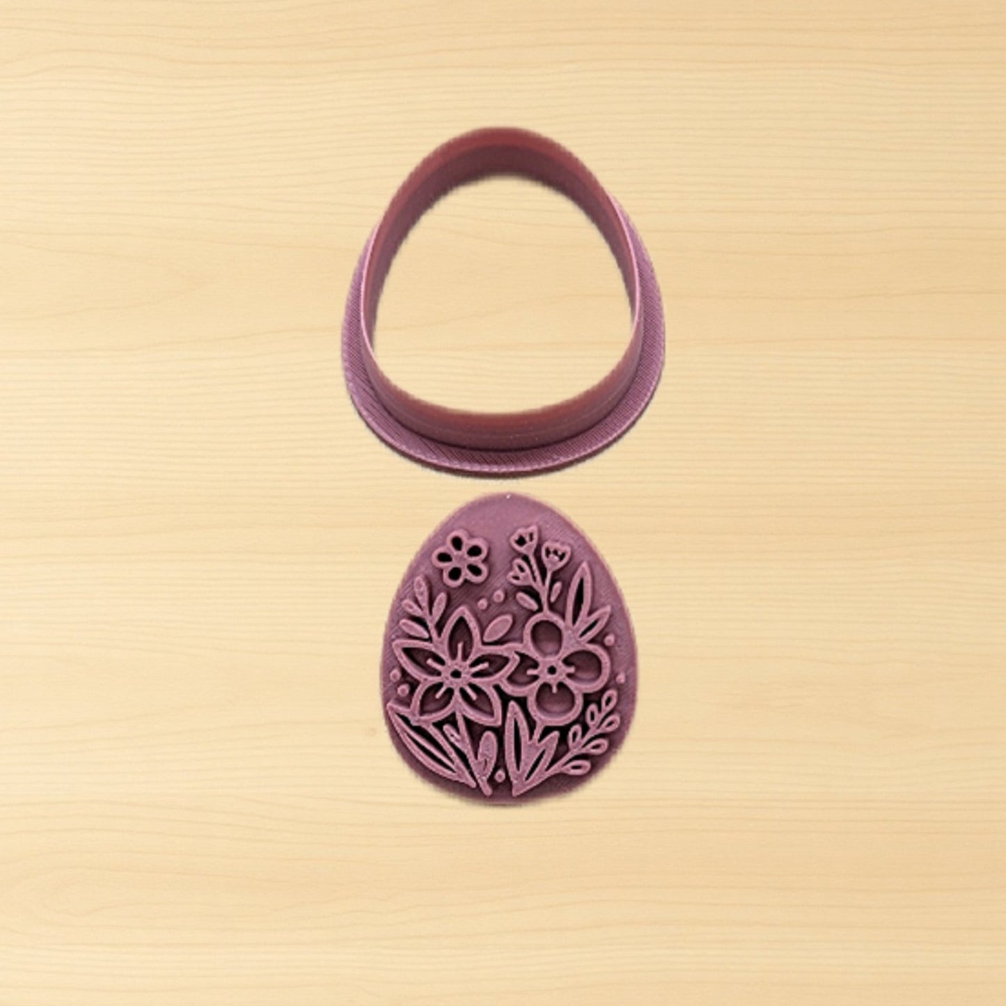 Purple floral cookie cutter on a beige background