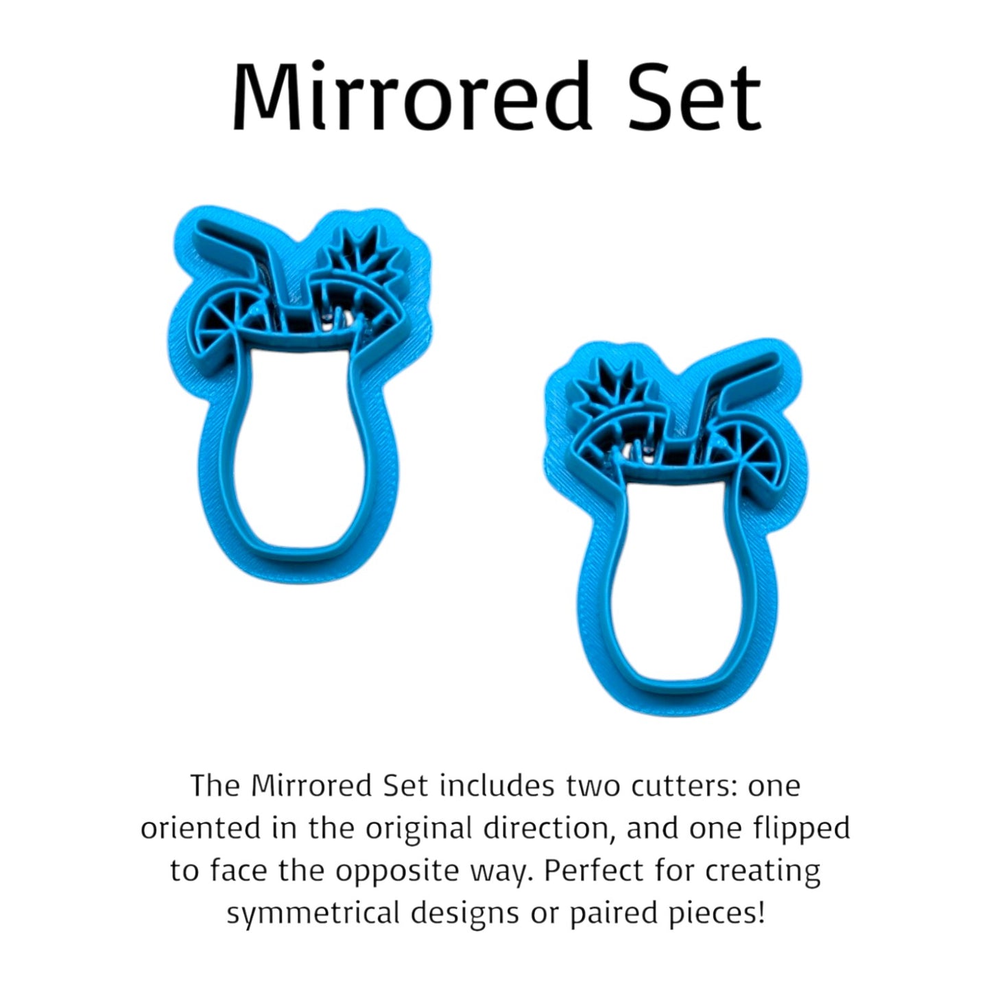 Two blue cookie cutters with a mirrored design on a white background