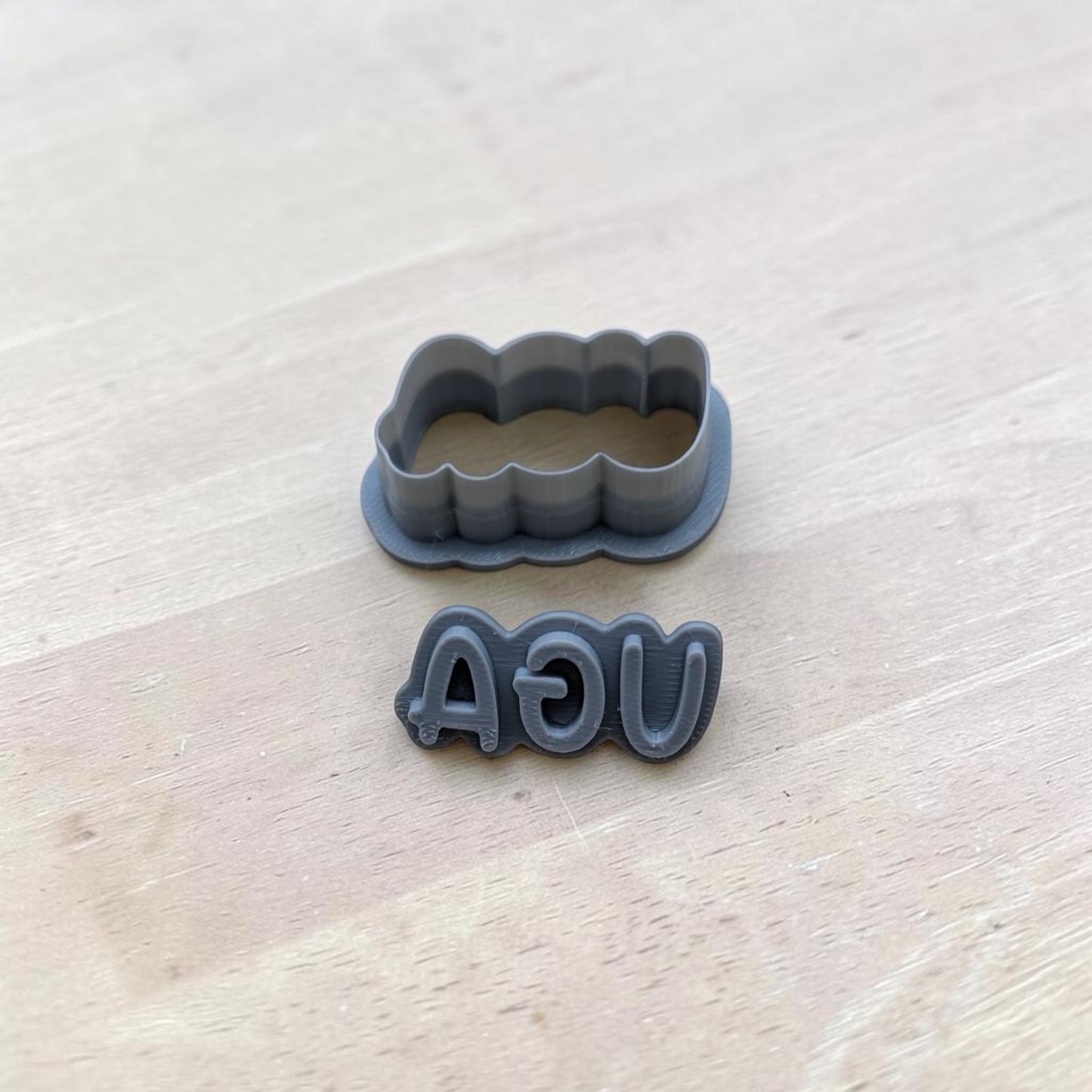 UGA cookie cutter and matching reversed stamp 3D printed in gray plastic for baking or polymer clay crafts