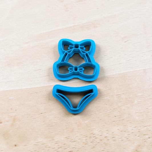 2-Piece Bikini-shaped cookie cutters on a wooden surface