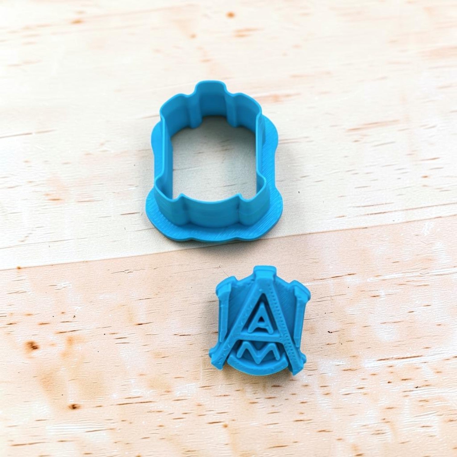 blue alabama a&m inspired cookie cutter and stamp set for cookies fondant and clay crafts on wood background