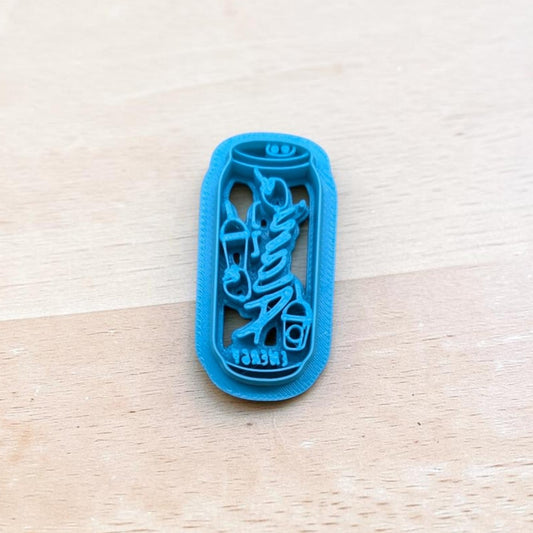 Blue 3D‑printed Alani Nu energy drink can cookie cutter on light wood background — perfect for cookies, fondant, and polymer clay.
