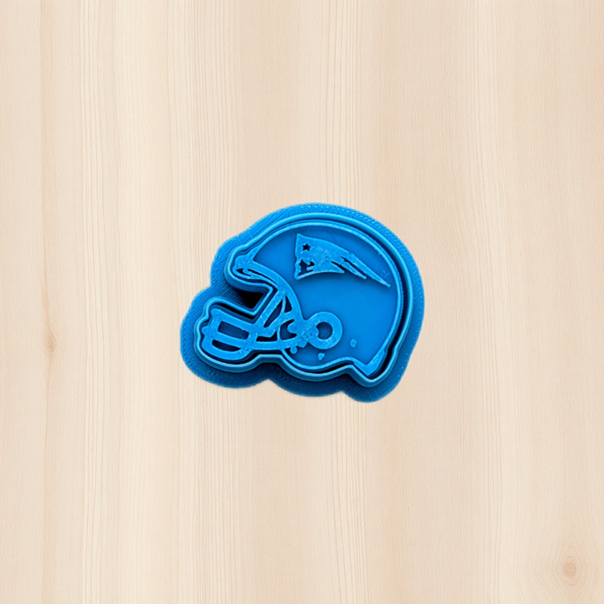 New England Patriots football helmet cookie cutter and stamp set for detailed cookies, fondant, and polymer clay crafts, featuring crisp team‑inspired lines for game day baking and sports‑themed projects.