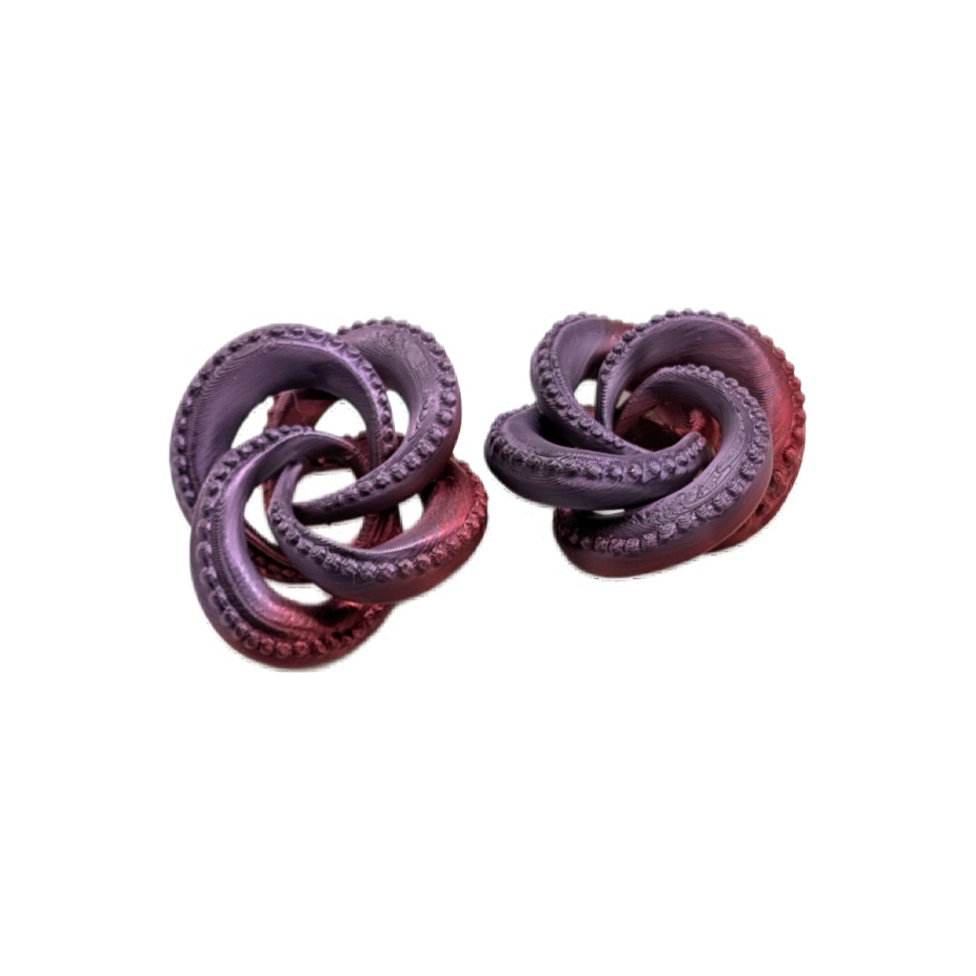 Pair of purple knot-shaped earrings on a white background