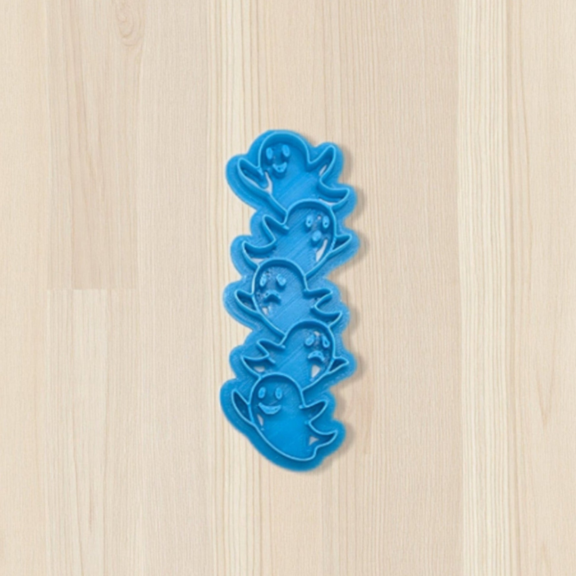 Ghost Totem Bookmark Cutter on a wooden surface