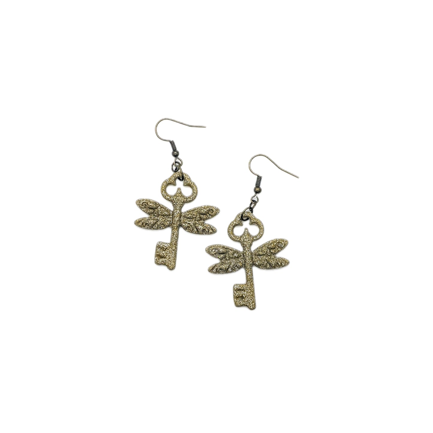 Pair of Harry Potter flying key earrings on a white background