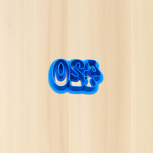 Blue cookie cutter shaped like the numbers '420' on a wood surface