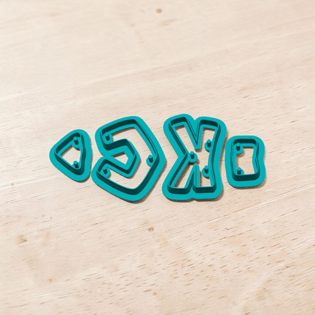 KC Arrowhead 4-piece layered cutter set with jump hook holes for polymer clay earrings and Kansas City football crafts