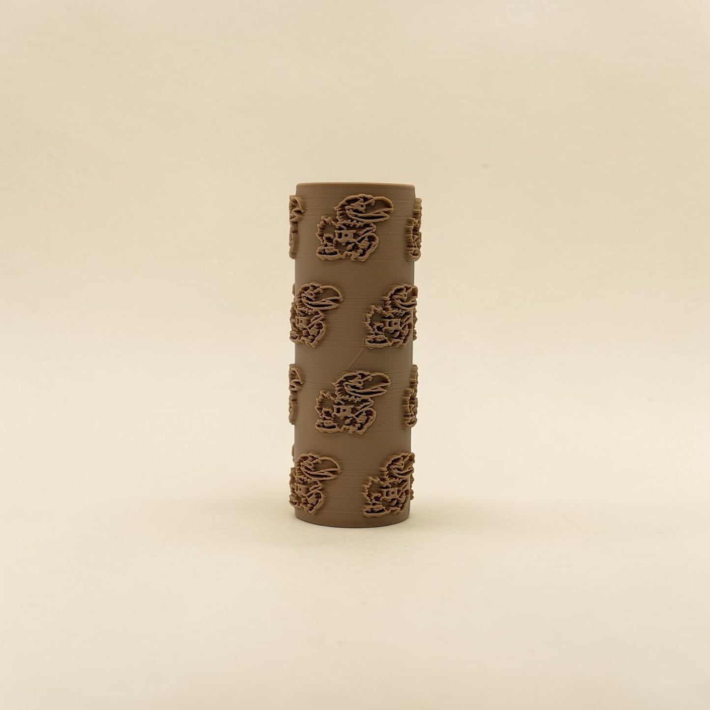 texture roller with KU Jayhawk pattern on a beige background