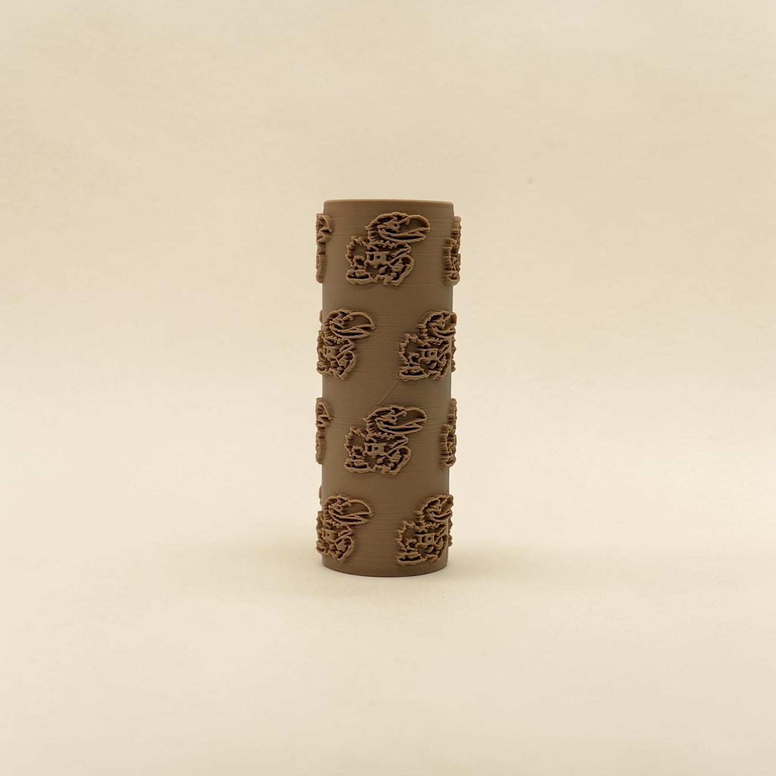 texture roller with KU Jayhawk pattern on a beige background