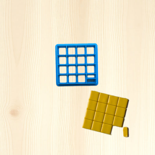 Blue mold with grid pattern on a beige surface