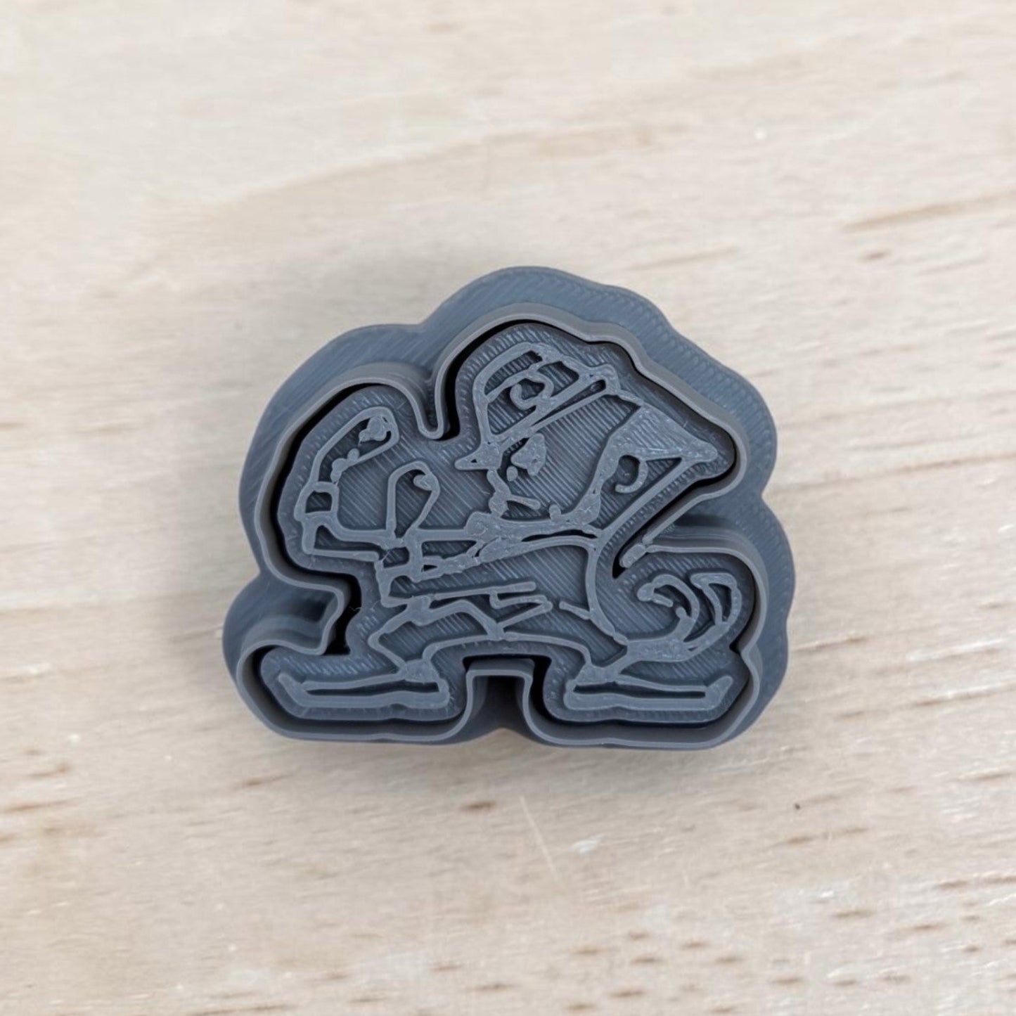 Notre Dame Fighting Irish leprechaun stamp and cutter – detailed 3D‑printed gray plastic design for cookies and crafts from Truley Unique.