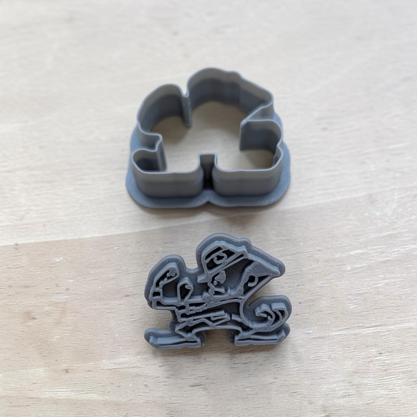 University of Notre Dame Fighting Irish cookie cutter and stamp set  3D‑printed gray plastic tools for cookies, fondant, polymer clay, and ceramics by Truley Unique.
