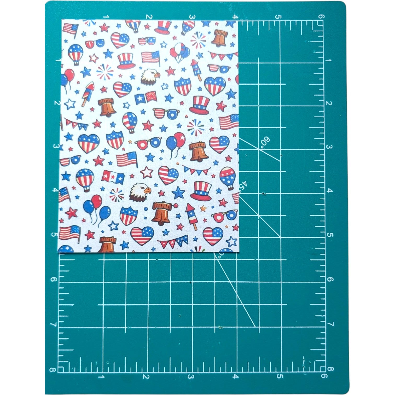 Patriotic Party Water‑Soluble Transfer Sheet for Polymer Clay patriotic designs on a teal cutting mat with measurements.