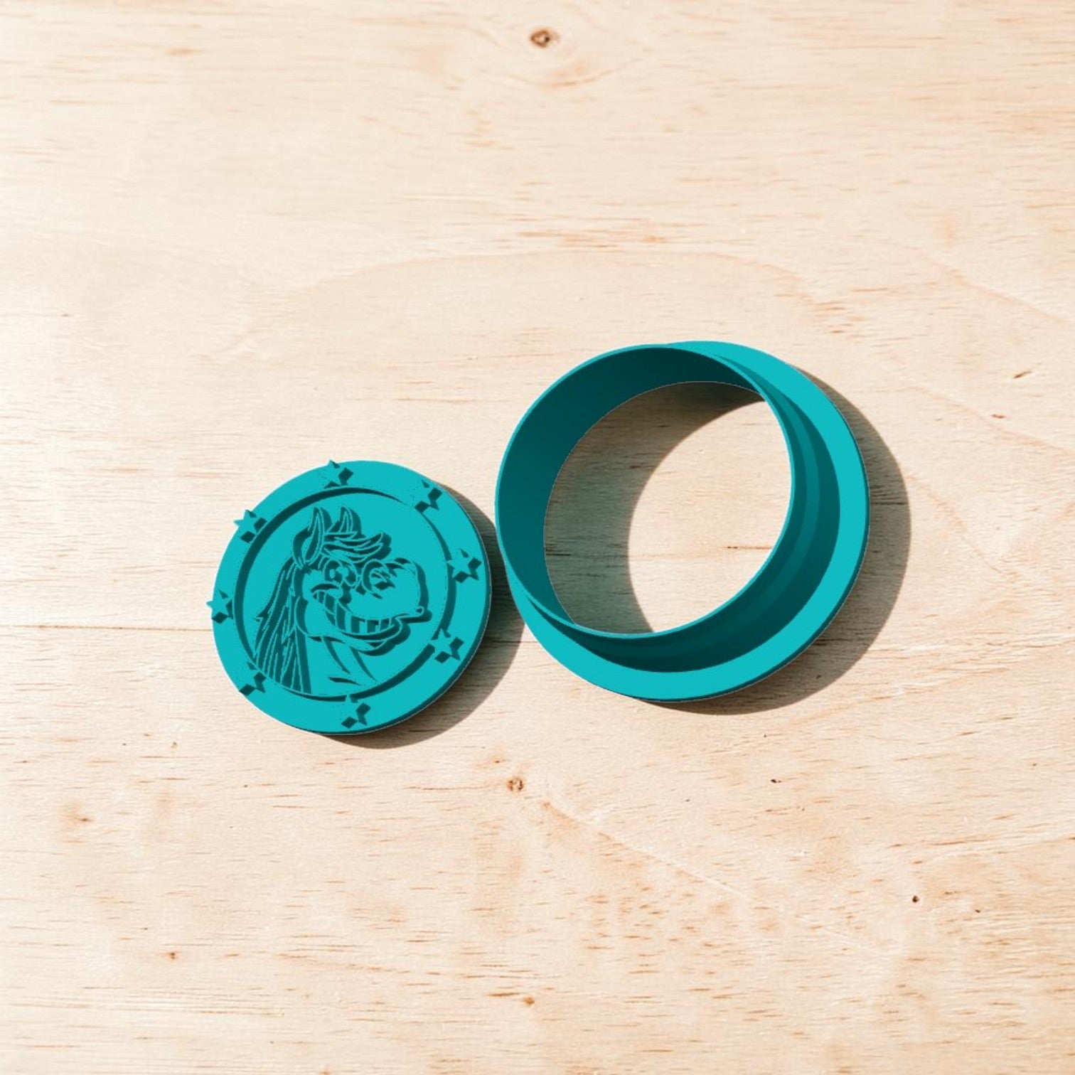 Patriot Horse Stamp and Cutter Set – Teal circular fondant and clay tool with detailed horse engraving and matching cutter ring.