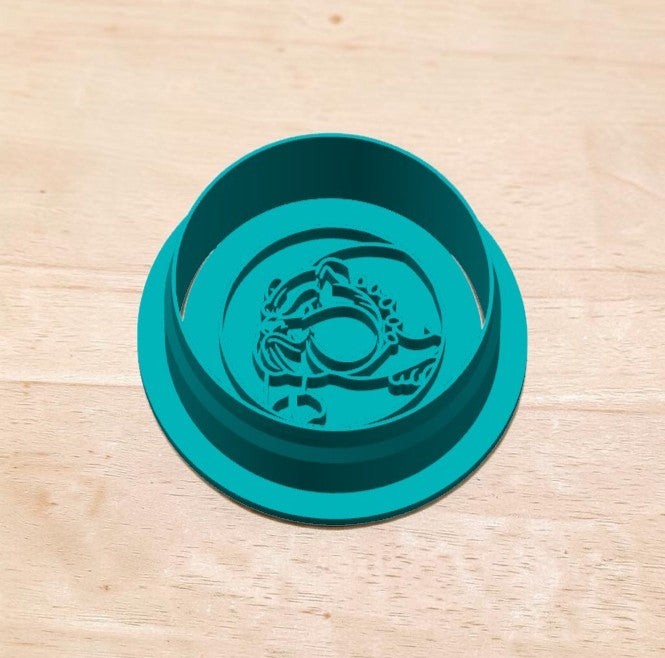 Bulldog mascot cookie cutter and embosser – teal 3D-printed baking tool for fondant, clay, and pottery, shown on wooden surface.
