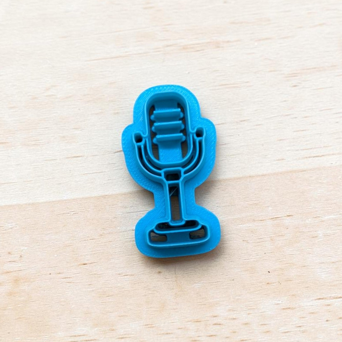 Ribbon Microphone Cookie Cutter in blue — 3D‑printed music‑themed cutter for cookies, fondant, polymer clay, and pottery.
