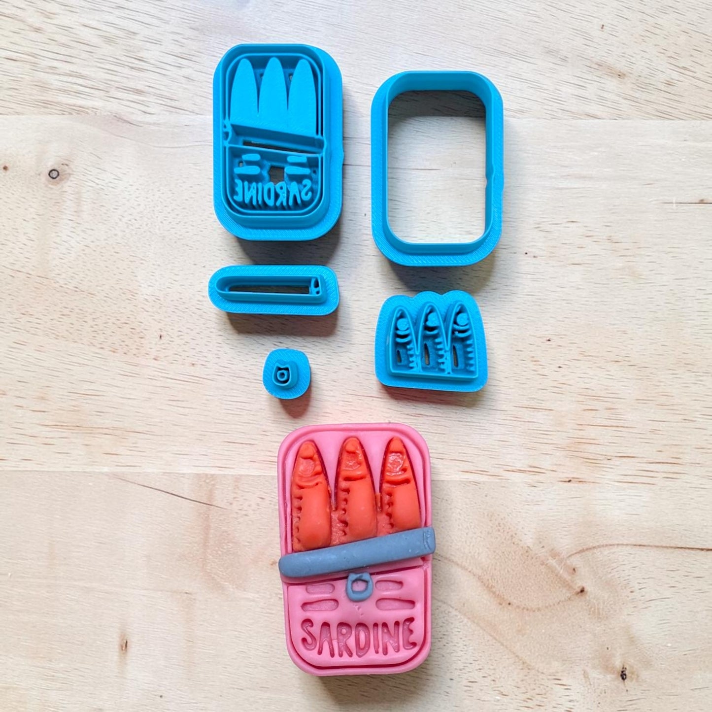 Sardine can cookie cutter set on a wooden surface