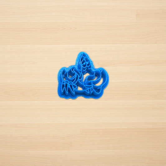 Blue Sebastian the crab cookie cutter on a wooden surface