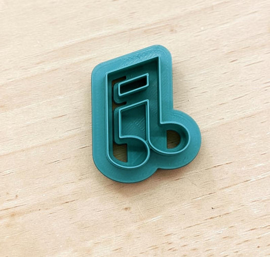 Slanted beamed sixteenth note cookie cutter in teal, 3D printed design for cookies, fondant, or clay crafts.