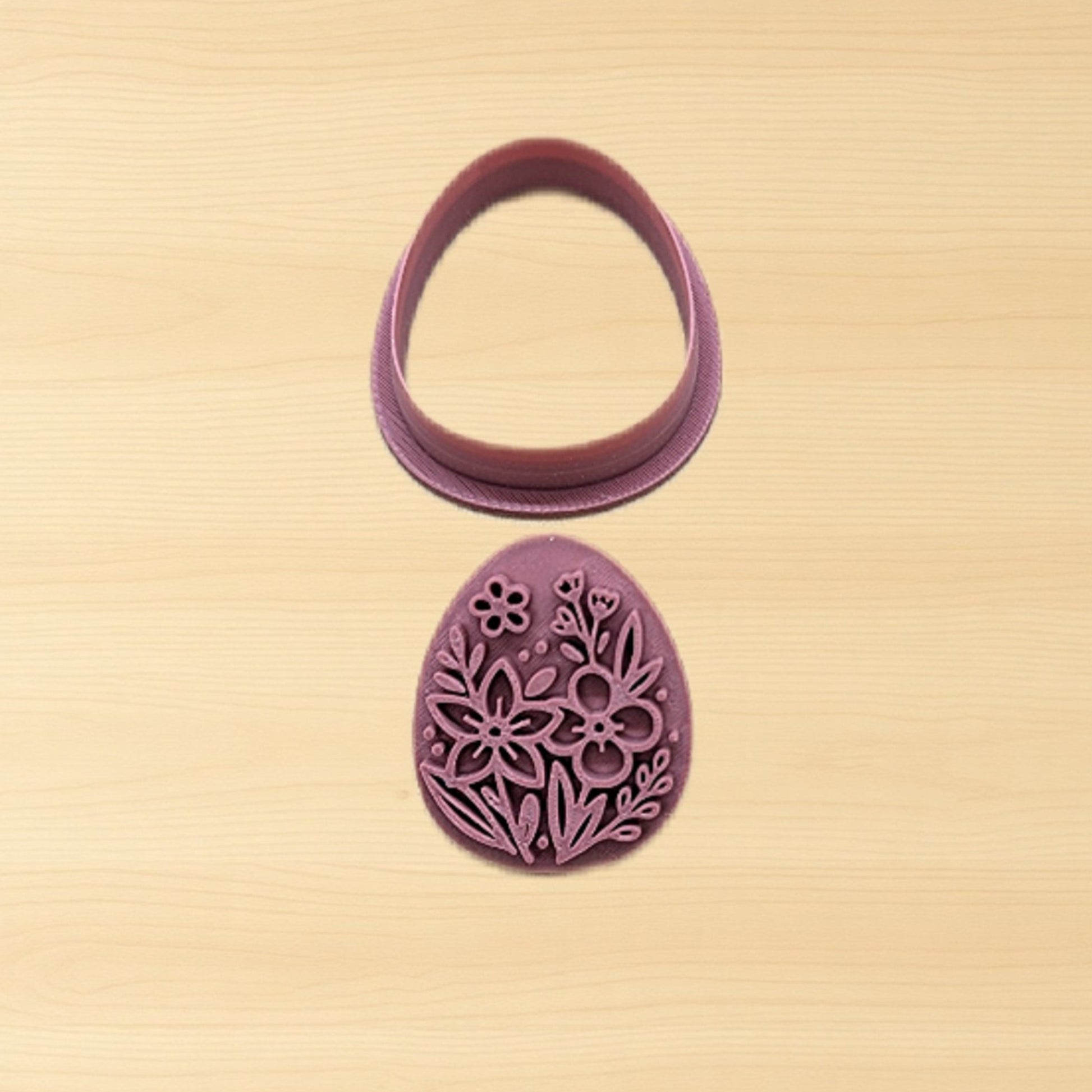 Purple floral cookie cutter on a beige background
