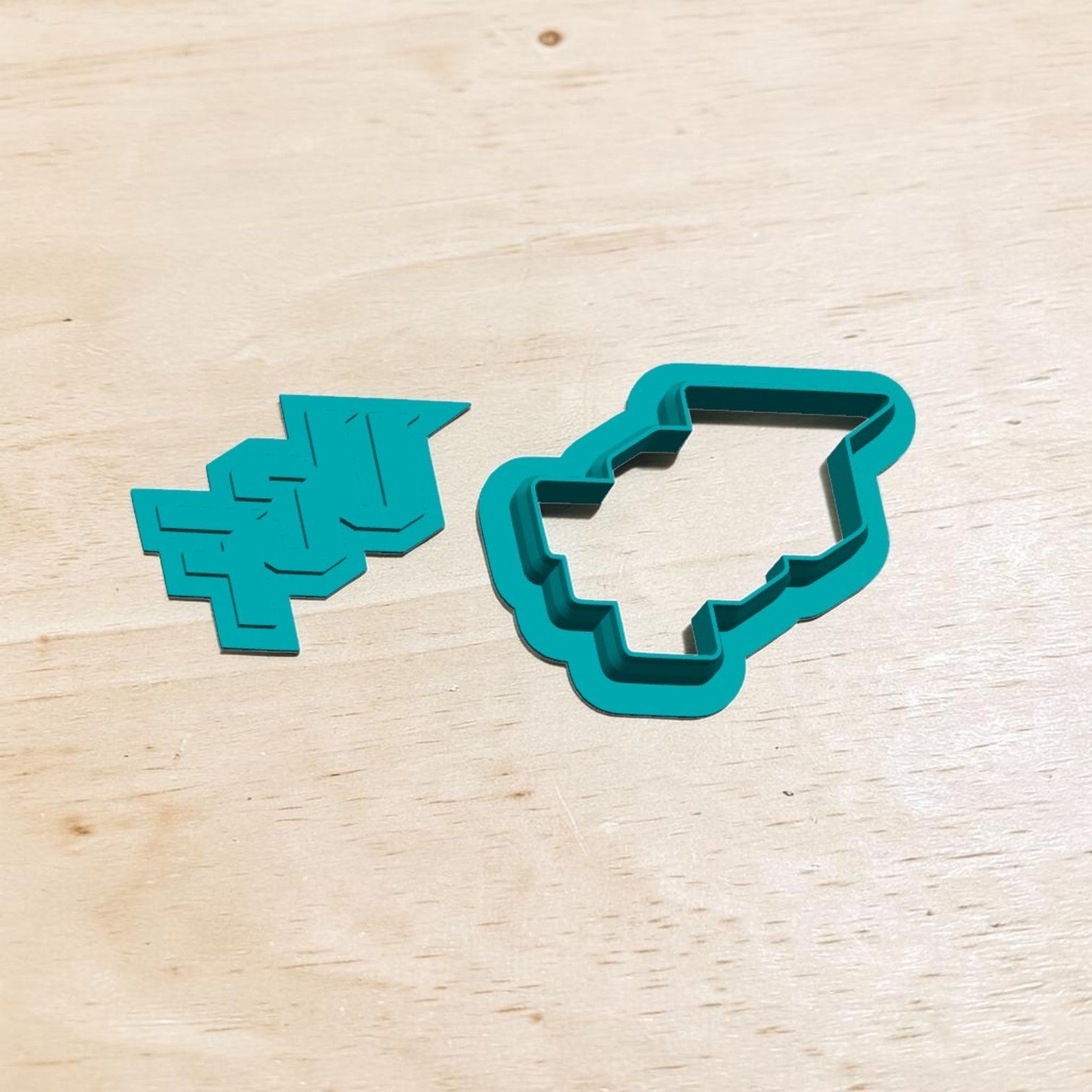 UCF logo cookie cutter and matching stamp set — teal 3D‑printed tools for baking, ceramics, and clay crafts.