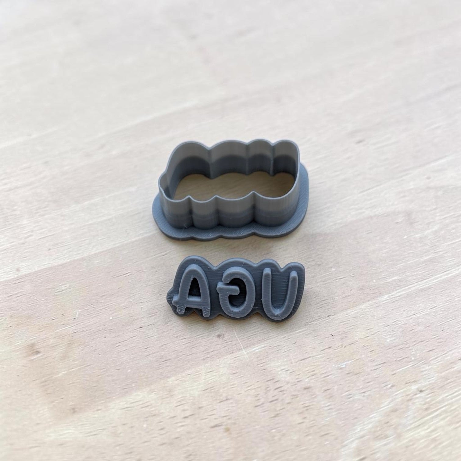 UGA cookie cutter and matching reversed stamp 3D printed in gray plastic for baking or polymer clay crafts