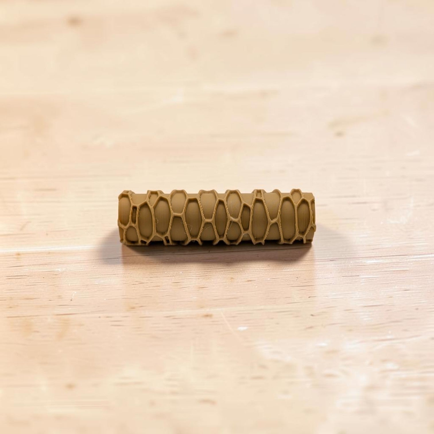 Brown textured object on a light wooden surface