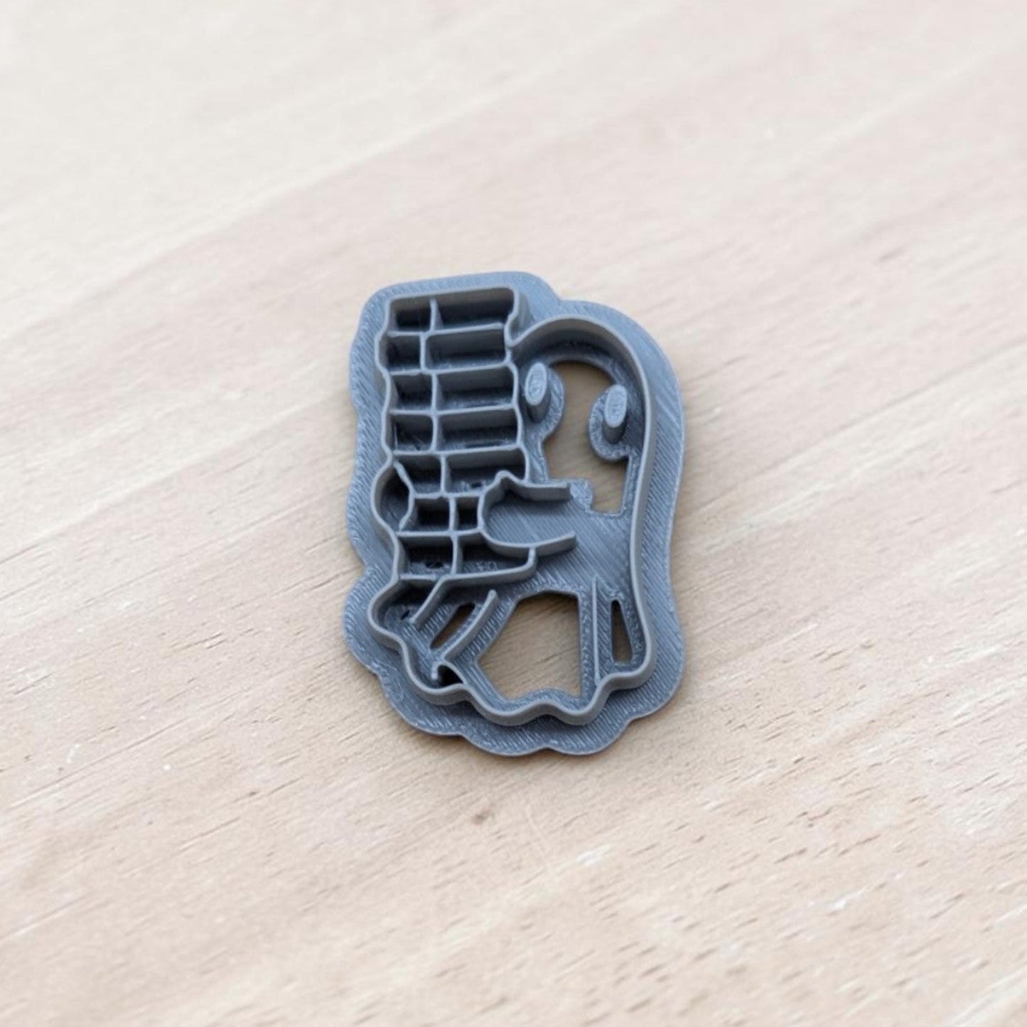 Ghost carrying book stack cookie cutter – 3D printed multi-medium tool for polymer clay, pottery, and fondant crafts.