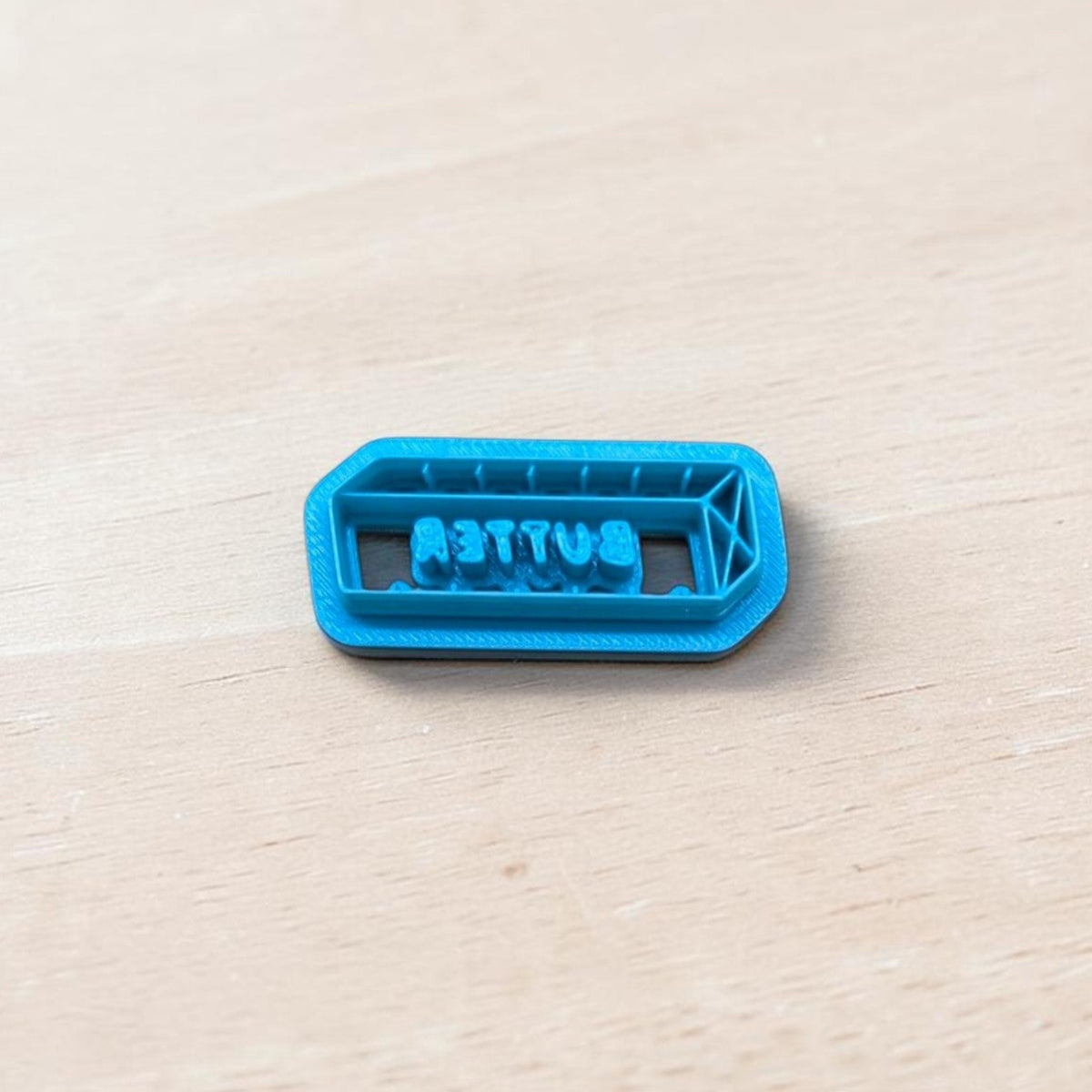 Blue 3D printed stick of butter cookie cutter with BUTTER lettering for cookies, polymer clay, fondant, pottery and ceramic crafts